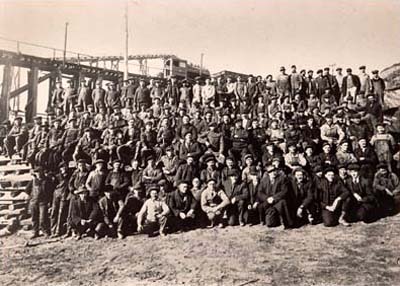 Workers pose for group photo at Phoenix Sand and Gravel Company, Port Washington, N.Y., 1910
