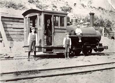 John, (left) Samuel, and Frank Petersen, uncles of Christian Christiansen, in front of  �dinkey engine�, 1910