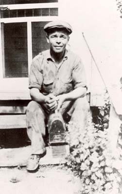 John Chekatauskas was born in Lithuania on August 5, 1890.  He came to Port Washington in 1914 and started working at the McCormack Sand Company.  He is seen returning home from a days work, 1930