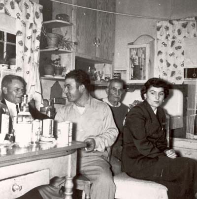 The Deriu family at home in the sandbanks, 1940s