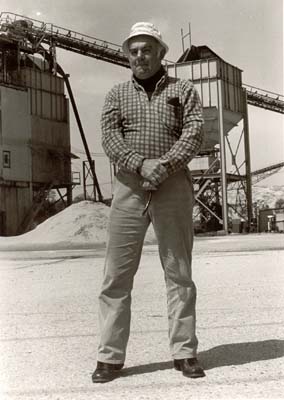 Sandminer poses in front of trestle, 1979