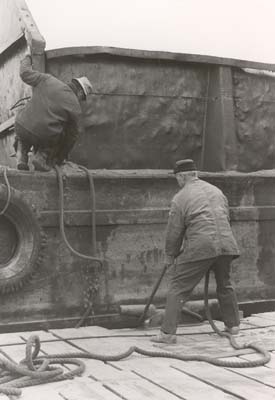 Santo Bassi pulls barge closer to dock, 1979