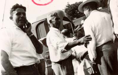 Men talking after company picnic, 1950�s