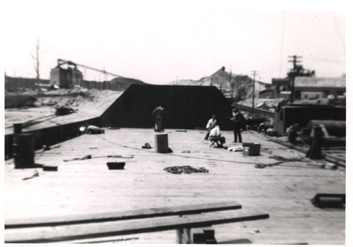 Caulking the seams of Colonial Sand Company barge, 1956. L-r: Red, Jerry Tedesco, Al Salerno