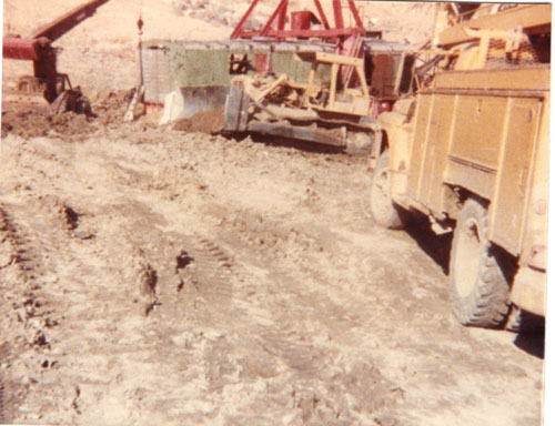 Marion 7200 drag line being operated by Billy Sherard, recovering drag line from cave-in at Colonial Sand Company, 1980