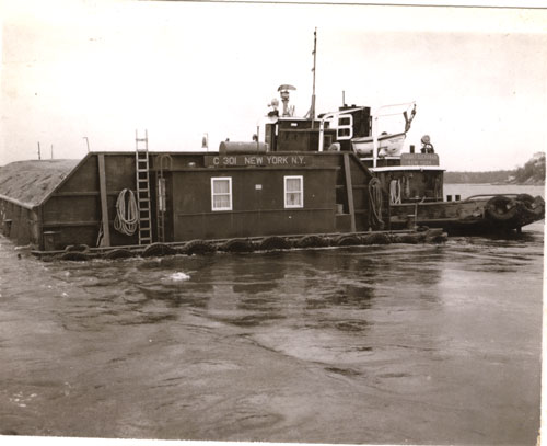 Bronx #2 barge, scow captain on board, heading out to New York City, 1960�s