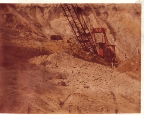 Excavating to prepare for ramp that would allow drag line to be rescued. It took two weeks to accomplish, 1980