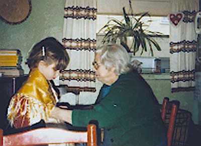 Madeline Frommja helps little Ganell Giagu get dressed for a Sardinian festival, c. 1980