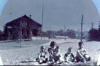 Gathering of miners children on West Shore Road, 1940